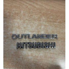 Эмблема Mitsubishi Outlander
